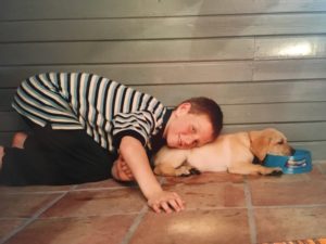 Sam at age 7 with his first dog, Ozzie
